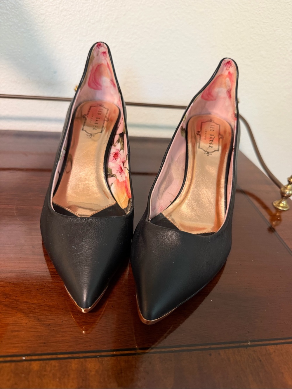 Ted Baker Black Pointed-Toe Pumps with Gold Toe Trim and Floral Lining Gold
